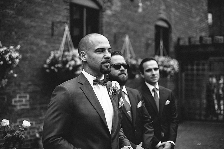 31-Groom-waiting-for-Bride-as-she-walks-down-the-aisle-in-Toronto-at-Distillery-District.jpg