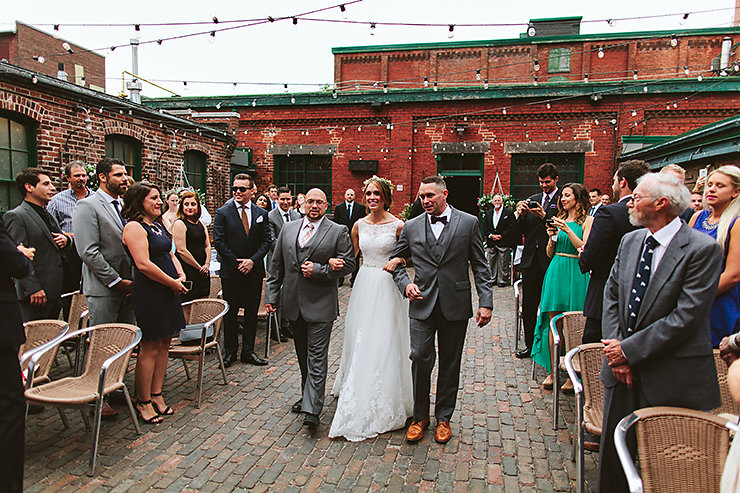 30-Distillery-District-Toronto-Bride-walking-down-the-aisle-wedding-photography.jpg