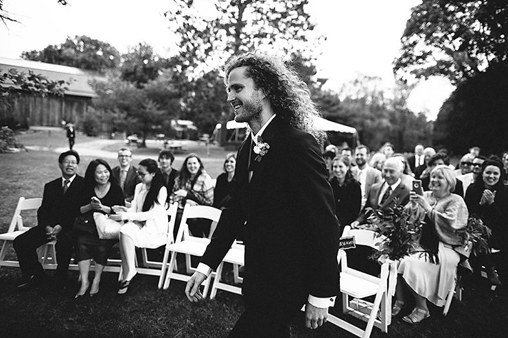 21-Groom-walking-down-aisle-at-Brooklands-Farm.jpg